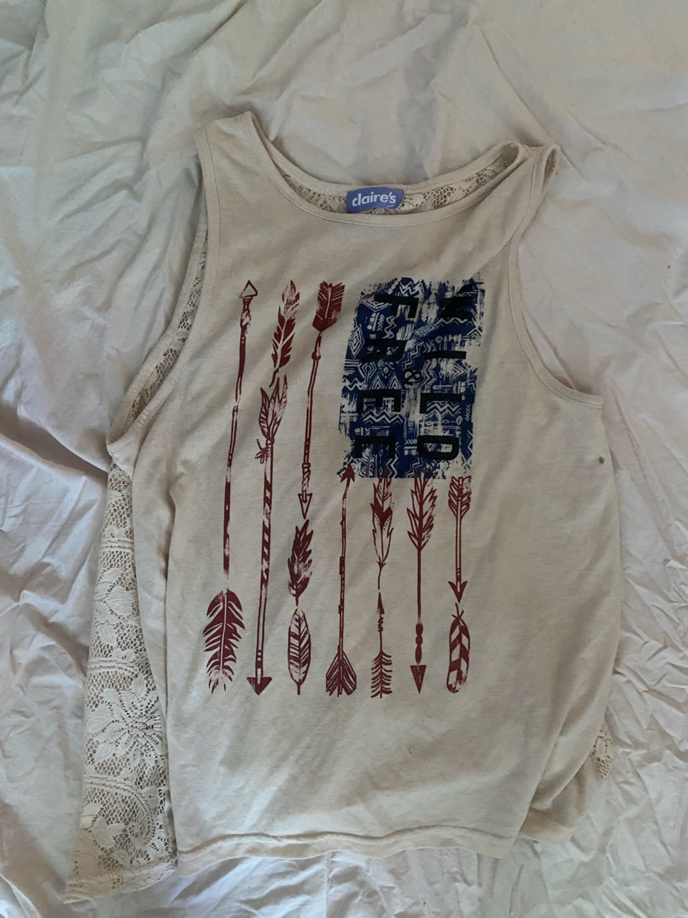 Claire's Cream Tank Top with Red Arrow Graphic and Blue Patch